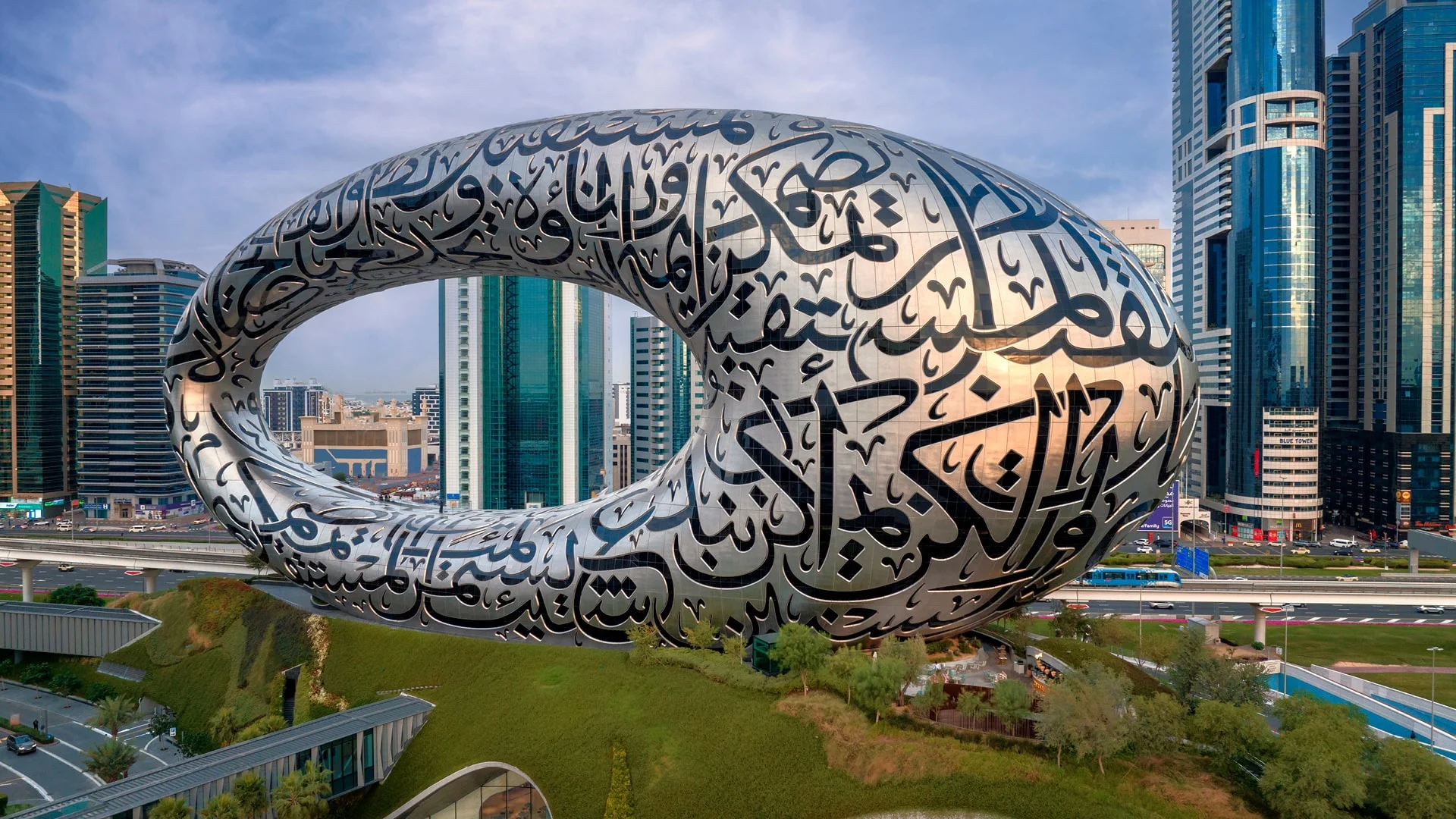 Dubai's Museum of the Future with Arabic calligraphy surrounded by modern skyscrapers